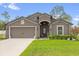Charming single-story home with a well-maintained lawn, landscape, and a welcoming front porch at 17485 Sw 36Th Ter, Ocala, FL 34473