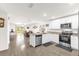 Bright, open kitchen with white cabinetry, stainless steel appliances, and granite countertops at 17485 Sw 36Th Ter, Ocala, FL 34473