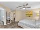 View of primary suite with wood-look flooring and an ensuite bathroom offering a spa-like retreat at 17485 Sw 36Th Ter, Ocala, FL 34473