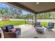 Spacious patio area offers outdoor relaxation with comfortable seating and a backyard view at 17485 Sw 36Th Ter, Ocala, FL 34473
