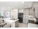 Bright kitchen with island, modern appliances, and ample counter space at 214 Oak Lane Rd, Ocala, FL 34472
