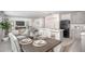 Kitchen with dining area, stainless appliances, and gray cabinets at 214 Oak Lane Rd, Ocala, FL 34472