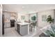 Modern kitchen with gray cabinets, island, and stainless steel appliances at 214 Oak Lane Rd, Ocala, FL 34472