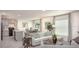 Open-concept living area with natural light and kitchen access at 214 Oak Lane Rd, Ocala, FL 34472