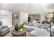 Open-concept living room with modern gray tones, kitchen, dining area, and stylish decor at 214 Oak Lane Rd, Ocala, FL 34472