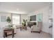 Comfortable living room with modern decor, large window, and television at 214 Oak Lane Rd, Ocala, FL 34472