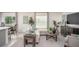 Cozy living room with modern furniture and lots of natural light at 214 Oak Lane Rd, Ocala, FL 34472