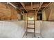 View of the basement featuring wooden beams and a ladder for access at 2154 Lake Christie Dr, Orlando, FL 32809