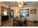 Cozy dining room with wood floors and a clear view into the living room at 2154 Lake Christie Dr, Orlando, FL 32809