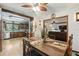 Dining room showcasing hardwood floors and view into the kitchen and living room at 2154 Lake Christie Dr, Orlando, FL 32809