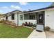 Charming front porch featuring cozy seating and views through to the living room at 2154 Lake Christie Dr, Orlando, FL 32809