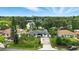 Charming single-story home features solar panels, a long driveway, and lovely landscaping with a lake view at 2154 Lake Christie Dr, Orlando, FL 32809