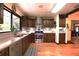 Beautiful kitchen with stainless steel appliances, ample storage, and hardwood floors at 2154 Lake Christie Dr, Orlando, FL 32809