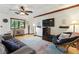 This cozy living room offers hardwood floors, stylish decor, and large windows at 2154 Lake Christie Dr, Orlando, FL 32809
