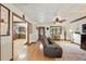 Inviting living room with hardwood floors, tin ceiling, and access to the kitchen at 2154 Lake Christie Dr, Orlando, FL 32809
