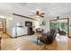 Spacious living room with hardwood floors, ceiling fan, and comfortable seating overlooking the yard at 2154 Lake Christie Dr, Orlando, FL 32809
