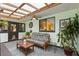 Inviting covered patio with comfortable seating, plants, and natural light, ideal for relaxation and gatherings at 2154 Lake Christie Dr, Orlando, FL 32809