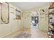 Bright storage area featuring a window, shelving, and doorway leading to a covered patio, offering functionality at 2154 Lake Christie Dr, Orlando, FL 32809