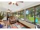 Bright sun room has large windows offering great light and yard views at 2154 Lake Christie Dr, Orlando, FL 32809