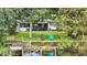 Lake view of the property featuring a waterfront with a dock and lush greenery, providing a serene setting at 2154 Lake Christie Dr, Orlando, FL 32809