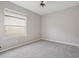 Bedroom featuring soft carpet, ceiling fan, and a bright window at 2315 Black Lake Blvd, Winter Garden, FL 34787