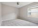 Bright bedroom features soft carpet and a bright window at 2315 Black Lake Blvd, Winter Garden, FL 34787