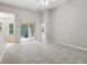 Large bedroom featuring high ceilings, sliding glass doors, and plush carpeting for ultimate comfort at 2315 Black Lake Blvd, Winter Garden, FL 34787
