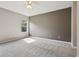Spacious bedroom features soft carpet, ceiling fan, and a bright window at 2315 Black Lake Blvd, Winter Garden, FL 34787