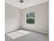 Cozy bedroom features soft carpet and large, bright window at 2315 Black Lake Blvd, Winter Garden, FL 34787