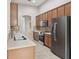 Modern kitchen with stainless steel appliances, granite countertops, and ample cabinet storage space at 2315 Black Lake Blvd, Winter Garden, FL 34787