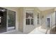 View of covered patio with sliding glass doors and outside access door for convenience at 2315 Black Lake Blvd, Winter Garden, FL 34787