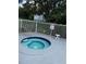 Relax in the community hot tub, surrounded by lush landscaping near the pool area at 2592 Grassy Point Dr # 106, Lake Mary, FL 32746