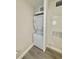 Efficient, compact laundry area features stacked washer and dryer, maximizing space in unit at 2592 Grassy Point Dr # 106, Lake Mary, FL 32746