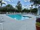 Enjoy the sparkling community pool, perfect for relaxation and recreation surrounded by lounge chairs at 2592 Grassy Point Dr # 106, Lake Mary, FL 32746