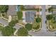 An overhead view of home showing its location on a corner lot with mature trees and a large patio at 2674 Sugar Pine Run, Oviedo, FL 32765