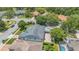 Aerial view of the home showcasing its lush landscaping, private backyard, and brick paver patio at 2674 Sugar Pine Run, Oviedo, FL 32765