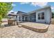 An outdoor paver patio features two gazebos and a built-in brick seating area at 2674 Sugar Pine Run, Oviedo, FL 32765