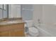 Bright bathroom features a vanity with granite counters and a tub and shower at 2674 Sugar Pine Run, Oviedo, FL 32765