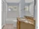 Tiled bathroom with granite countertop and walk-in shower at 2674 Sugar Pine Run, Oviedo, FL 32765