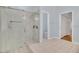 Modern bathroom featuring a walk-in shower with glass doors and tile flooring at 2674 Sugar Pine Run, Oviedo, FL 32765