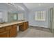 Bathroom with dual sinks, granite countertops, and a walk-in shower at 2674 Sugar Pine Run, Oviedo, FL 32765