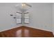 Neutral bedroom with ceiling fan, two windows, and wood-look floors at 2674 Sugar Pine Run, Oviedo, FL 32765