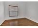 Clean bedroom with wood floors and a window with natural light at 2674 Sugar Pine Run, Oviedo, FL 32765