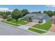 Charming home featuring a well-manicured lawn, mature trees, and a two-car garage at 2674 Sugar Pine Run, Oviedo, FL 32765