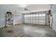 Spacious garage with white door, storage shelving, and ample room at 2674 Sugar Pine Run, Oviedo, FL 32765