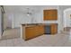 Bright kitchen with stainless dishwasher, granite countertops, and tile flooring at 2674 Sugar Pine Run, Oviedo, FL 32765