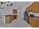 Functional kitchen featuring stainless steel appliances, light cabinetry, and ample countertop space at 2674 Sugar Pine Run, Oviedo, FL 32765