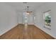 Large living room with wood floors, a ceiling fan, and lots of natural light at 2674 Sugar Pine Run, Oviedo, FL 32765