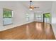 Spacious living room with vaulted ceiling and large windows for plenty of natural light at 2674 Sugar Pine Run, Oviedo, FL 32765