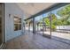 Covered patio overlooking an outdoor grilling area and backyard at 2674 Sugar Pine Run, Oviedo, FL 32765